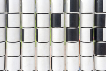 white and black cylinders in random order