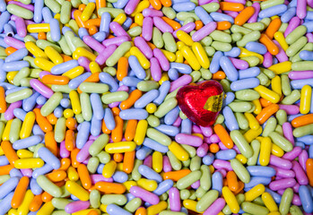 Colorful chocolate chocolates with gold heart
