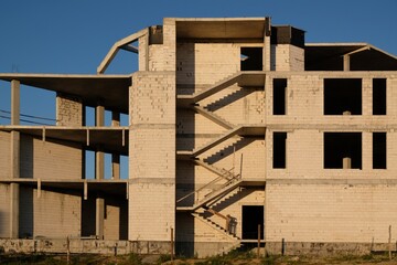 Construction of a new unfinished residential building. View of the stairs structure.