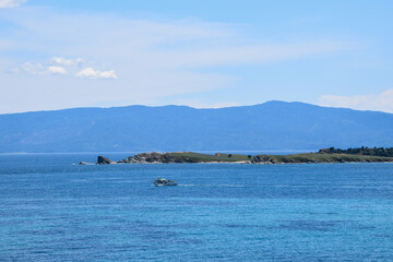 Fototapeta na wymiar Small fishing boat nearby a rural island in greece