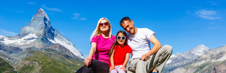 Active family hiking in high alpine region in alps