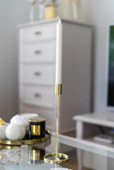 Trendy white home deccoration - 
candles, flowers 