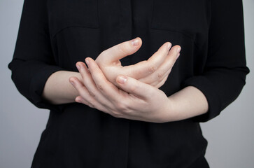 Woman suffers from pain in fingers. Arthritis or arthrosis, cartilage wear, rheumatism of the...