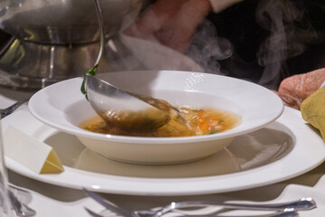  Older woman Eating Soup At a Restaurant setting
