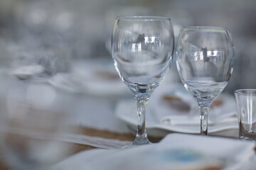 two glasses for wine at a wedding table in a restaurant