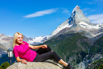 Naklejka na ściany i meble Woman hikers in the Alps, Matterhorn peak in Switzerland