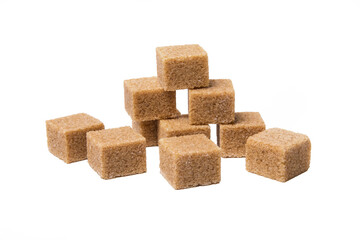 Pieces of cane sugar isolated on white background