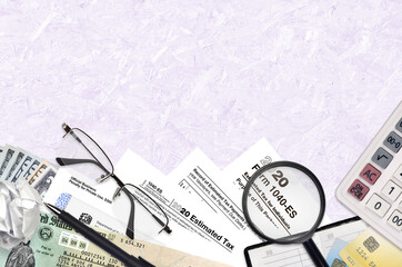 IRS form 1040-es Estimated tax for Individuals lies on flat lay office table and ready to fill....