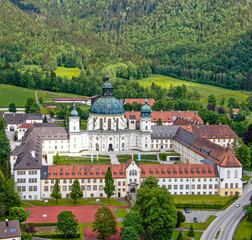 Ettal Abbey, called Kloster Ettal, a monastery in the village of Ettal, Bavaria, Germany - aerial...