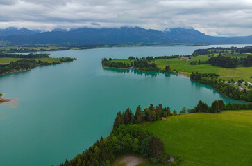 Aerial view over Lake Forggensee at the city of Fuessen in Bavaria Germany