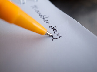 Fototapeta premium A yellow pen on a blank page notebook.