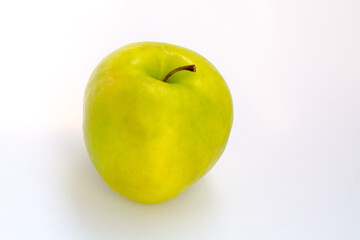 yellow-green Apple on a white background