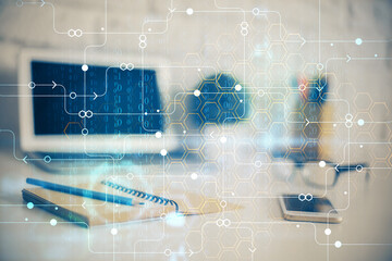 Double exposure of desktop computer and technology theme hologram. Concept of software development.