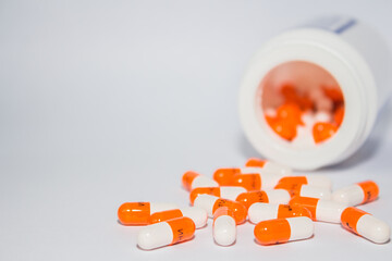 Tablets. Orange capsules.