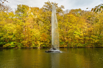 Autumn landscape with fountain and yellow trees, Ukraine, Uman, Sofievka park