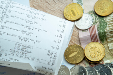 Moscow, Russia, April 21, 2020, Cash receipt and money of the Russian Federation, the concept of increasing food prices and rising unemployment. Social theme.
