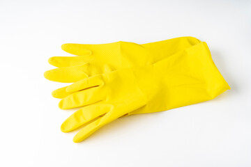 latex gloves on a white background, yellow dishwashing gloves isolated