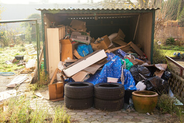 Garbage dump in the garage and in the backyard of the house. How not to use the garage.