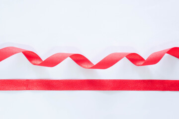 red ribbon on a white background