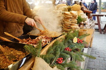 Traditional Polish round bread at a Christmas Market stall in Krakow, Poland. Traditional Polish street food. 
