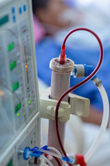 Dialysis machine is working. Acting as a substitute for the kidneys to drive waste from the body.