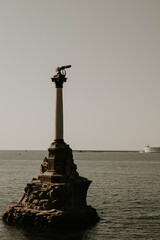 Monument to the Scuttled ships in Sevastopol in summer. Photo in retro style.
