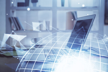 Multi exposure of table with computer and world map hologram. International data network concept.