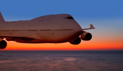 Fototapeta na wymiar Passenger airplane in the sky at sunset 