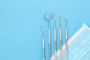 Dental tools on blue background