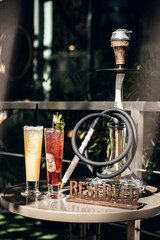 Summer detox beverage concept. Citrus fruit drinks with ice alcohol. Healthy diet cocktail with making bar tools. Vitamin fortified water