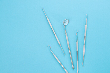 Dental tools on blue background