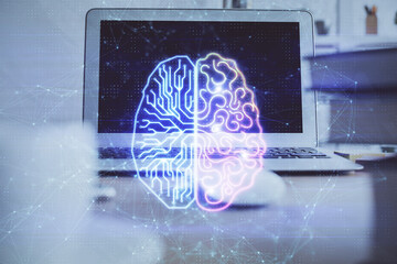Double exposure of table with computer and brain hologram. Data innovation concept.