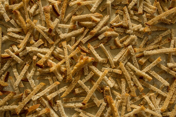 Homemade bread croutons texture background top view. Crispy bread cubes pattern, dry rye crumbs wallpaper, rusks mockup