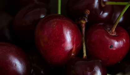 red cherries on a black background