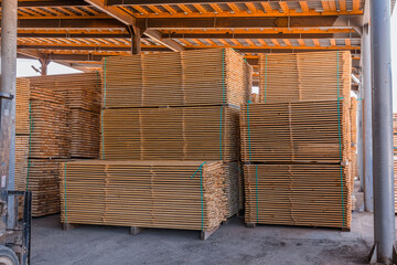 Stacks of chopped planks ready to be shipped. Lumber industry. Woodworking factory.