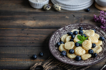 Lazy cottage cheese dumplings with fresh berry. Simple and healthy breakfast