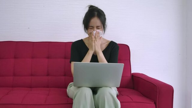One young pretty woman unwell sneeze using her handkerchief tisue close nose and mouth she was not infect corona virus disease.