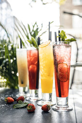Summer detox beverage concept. Citrus fruit drinks with ice alcohol. Healthy diet cocktail with making bar tools. Vitamin fortified water