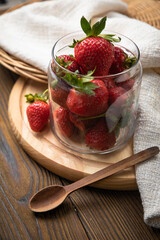 ripe farm strawberries on a wooden background

