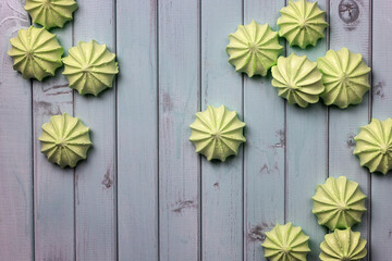 Apple green fresh homemade marshmallows. Marshmallows on a light wooden table. The view from the top.
