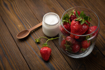 ripe farm strawberries on a wooden background

