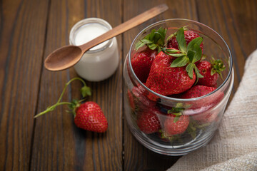 ripe farm strawberries on a wooden background

