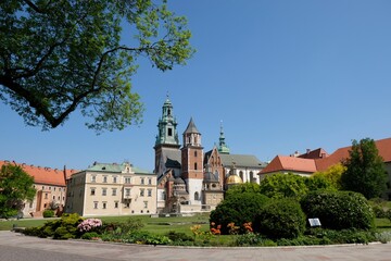 Fototapeta na wymiar Royal Wawel Castle and beautiful garden with colorful flowers. Cracow, Poland. 