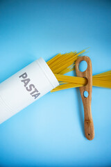 Italian pasta for a restaurant on a blue table background top view.