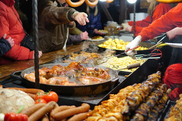 Food booth selling traditional Polish street food at a Christmas Market stall in Krakow, Poland. Traditional Polish street food in Cracow.    