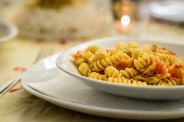 hot fusilli pasta with tuna fish and olives sauce closeup