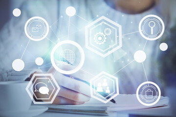 Social network theme hologram over woman's hands writing background. Concept of international people connect. Double exposure