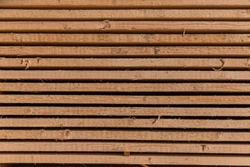 Wood factory stock and lumber board with nature business export. Stack of lumber wood in timber log storage. Wood processing joinery work wooden furniture. Wood timber construction material.
