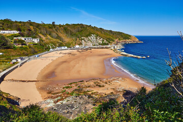 Image of La Greve de Lecq in the mornig sumer sunshine at low tide with sandy beach and clear...