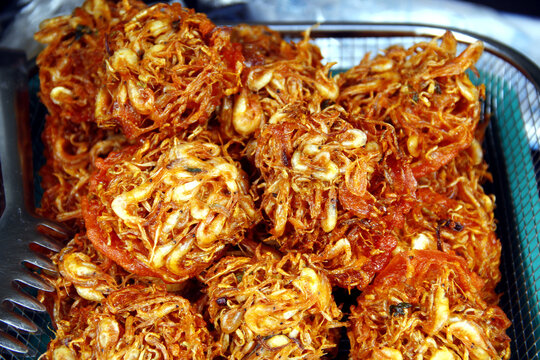 Freshly cooked Filipino food called Okoy or Filipino Shrimp fritters made of deep fried baby shrimps